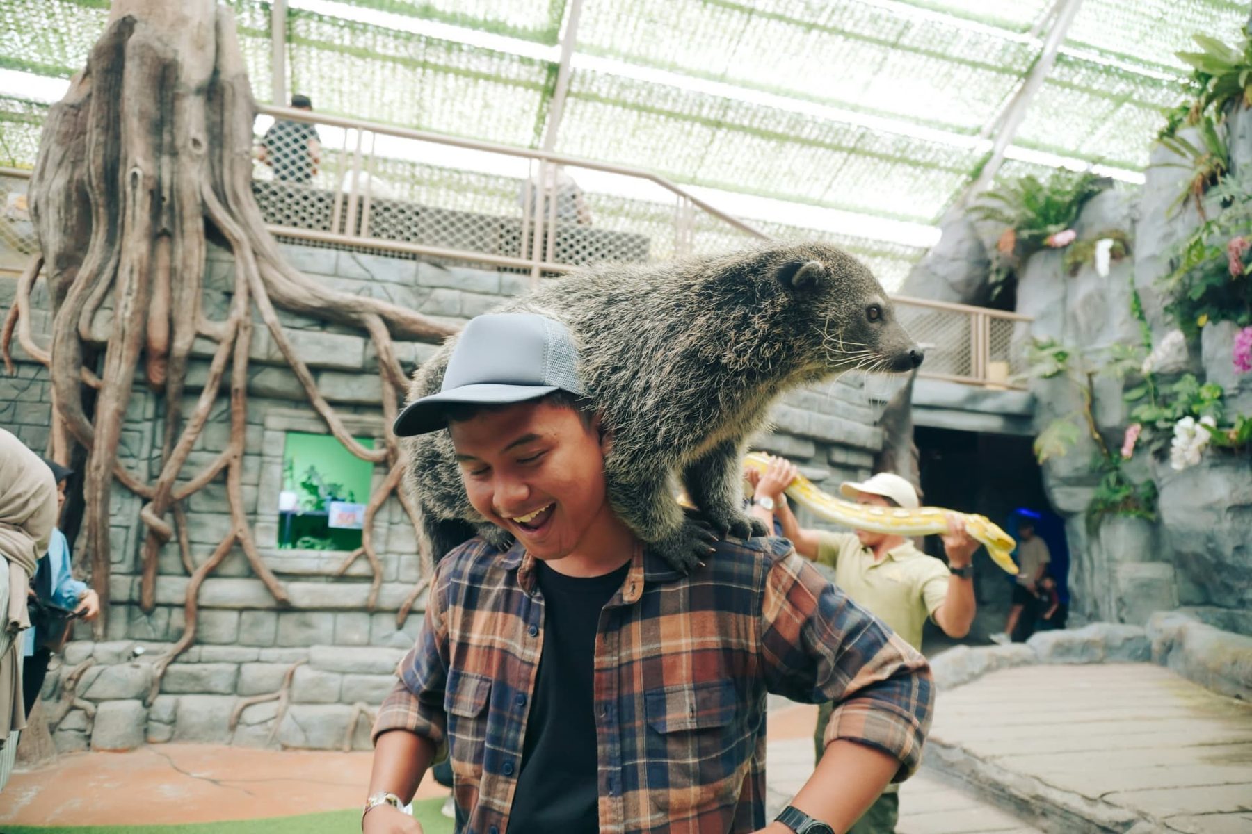 A guest laughing during an up-close animal encounter